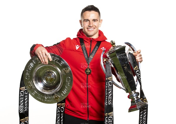 270321 - Wales Rugby Team Presented with Guinness Six Nations Trophy -  Owen Watkin with the trophy and triple crown