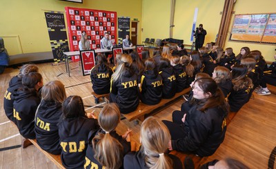 080323 - Wales Women 6 Nations Squad Announcement, Ysgol Dyffryn Aman, Ammanford - Wales Women Rugby head coach Ioan Cunningham and players Hannah Jones, left and Ffion Lewis return to their former school to speak to girls about their rugby careers and to formally announce the Wales Women’s squad for the forthcoming Women’s 6 Nations