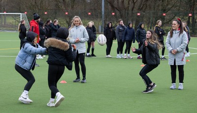 080323 - Wales Women 6 Nations Squad Announcement, Ysgol Dyffryn Aman, Ammanford - Wales Women players Hannah Jones and Ffion Lewis return to their former school and take a girls rugby skills session after the girls helped to formally announce the Wales Women’s squad for the forthcoming Women’s 6 Nations