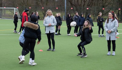 080323 - Wales Women 6 Nations Squad Announcement, Ysgol Dyffryn Aman, Ammanford - Wales Women players Hannah Jones and Ffion Lewis return to their former school and take a girls rugby skills session after the girls helped to formally announce the Wales Women’s squad for the forthcoming Women’s 6 Nations