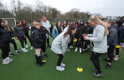 080323 - Wales Women 6 Nations Squad Announcement, Ysgol Dyffryn Aman, Ammanford - Wales Women Rugby head coach Ioan Cunningham and players Hannah Jones and Ffion Lewis return to their former school and take a girls rugby skills session after the girls helped to formally announce the Wales Women’s squad for the forthcoming Women’s 6 Nations