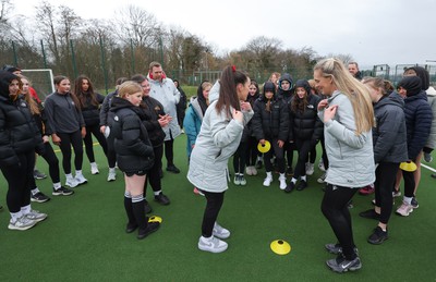 080323 - Wales Women 6 Nations Squad Announcement, Ysgol Dyffryn Aman, Ammanford - Wales Women Rugby head coach Ioan Cunningham and players Hannah Jones and Ffion Lewis return to their former school and take a girls rugby skills session after the girls helped to formally announce the Wales Women’s squad for the forthcoming Women’s 6 Nations