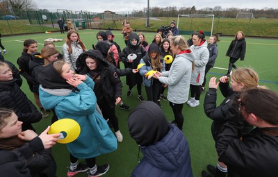 080323 - Wales Women 6 Nations Squad Announcement, Ysgol Dyffryn Aman, Ammanford - Wales Women Rugby head coach Ioan Cunningham and players Hannah Jones and Ffion Lewis return to their former school and take a girls rugby skills session after the girls helped to formally announce the Wales Women’s squad for the forthcoming Women’s 6 Nations