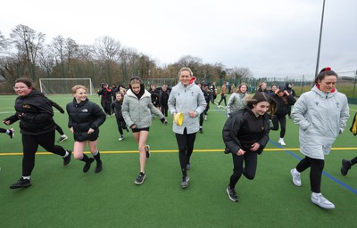 080323 - Wales Women 6 Nations Squad Announcement, Ysgol Dyffryn Aman, Ammanford - Wales Women players Hannah Jones and Ffion Lewis return to their former school and take a girls rugby skills session after the girls helped to formally announce the Wales Women’s squad for the forthcoming Women’s 6 Nations