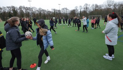 080323 - Wales Women 6 Nations Squad Announcement, Ysgol Dyffryn Aman, Ammanford - Wales Women players Hannah Jones and Ffion Lewis return to their former school and take a girls rugby skills session after the girls helped to formally announce the Wales Women’s squad for the forthcoming Women’s 6 Nations