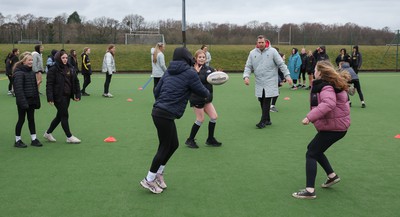 080323 - Wales Women 6 Nations Squad Announcement, Ysgol Dyffryn Aman, Ammanford - Wales Women Rugby head coach Ioan Cunningham and players Hannah Jones and Ffion Lewis return to their former school and take a girls rugby skills session after the girls helped to formally announce the Wales Women’s squad for the forthcoming Women’s 6 Nations