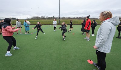 080323 - Wales Women 6 Nations Squad Announcement, Ysgol Dyffryn Aman, Ammanford - Wales Women players Hannah Jones and Ffion Lewis return to their former school and take a girls rugby skills session after the girls helped to formally announce the Wales Women’s squad for the forthcoming Women’s 6 Nations