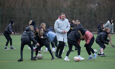 080323 - Wales Women 6 Nations Squad Announcement, Ysgol Dyffryn Aman, Ammanford - Wales Women Rugby head coach Ioan Cunningham and players Hannah Jones and Ffion Lewis return to their former school and take a girls rugby skills session after the girls helped to formally announce the Wales Women’s squad for the forthcoming Women’s 6 Nations