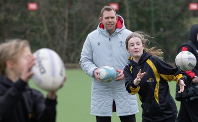 080323 - Wales Women 6 Nations Squad Announcement, Ysgol Dyffryn Aman, Ammanford - Wales Women Rugby head coach Ioan Cunningham and players Hannah Jones and Ffion Lewis return to their former school and take a girls rugby skills session after the girls helped to formally announce the Wales Women’s squad for the forthcoming Women’s 6 Nations