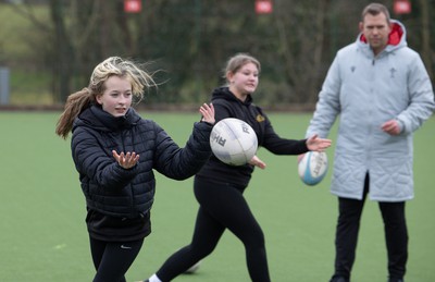 080323 - Wales Women 6 Nations Squad Announcement, Ysgol Dyffryn Aman, Ammanford - Wales Women Rugby head coach Ioan Cunningham and players Hannah Jones and Ffion Lewis return to their former school and take a girls rugby skills session after the girls helped to formally announce the Wales Women’s squad for the forthcoming Women’s 6 Nations