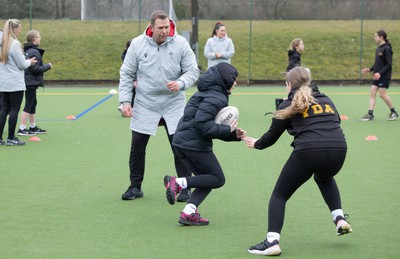 080323 - Wales Women 6 Nations Squad Announcement, Ysgol Dyffryn Aman, Ammanford - Wales Women Rugby head coach Ioan Cunningham and players Hannah Jones and Ffion Lewis return to their former school and take a girls rugby skills session after the girls helped to formally announce the Wales Women’s squad for the forthcoming Women’s 6 Nations