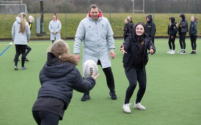 080323 - Wales Women 6 Nations Squad Announcement, Ysgol Dyffryn Aman, Ammanford - Wales Women Rugby head coach Ioan Cunningham and players Hannah Jones and Ffion Lewis return to their former school and take a girls rugby skills session after the girls helped to formally announce the Wales Women’s squad for the forthcoming Women’s 6 Nations