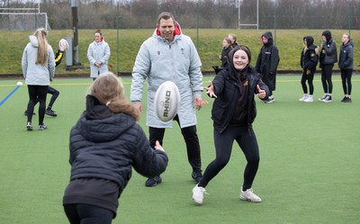 080323 - Wales Women 6 Nations Squad Announcement, Ysgol Dyffryn Aman, Ammanford - Wales Women Rugby head coach Ioan Cunningham and players Hannah Jones and Ffion Lewis return to their former school and take a girls rugby skills session after the girls helped to formally announce the Wales Women’s squad for the forthcoming Women’s 6 Nations