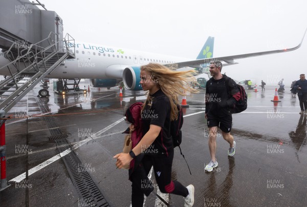 110424 - Wales Women Rugby Travel to Ireland - Catherine Richards disembarks the plane at a wet and windy Cork airport ahead of Wales’ Women’s 6 Nations match against Ireland