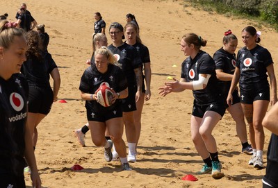 130625 Wales Women Rugby Squad Training at Merthyr Mawr dunes - Kelsey Jones of Wales and Abbie Fleming of Wales during a training and conditioning session at Merthyr Mawr sand dunes