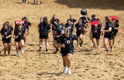 130625 Wales Women Rugby Squad Training at Merthyr Mawr dunes - Donna Rose leads the squad during a training and conditioning session at Merthyr Mawr sand dunes