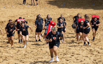 130625 Wales Women Rugby Squad Training at Merthyr Mawr dunes - Donna Rose leads the squad during a training and conditioning session at Merthyr Mawr sand dunes