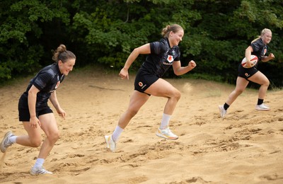 130625 Wales Women Rugby Squad Training at Merthyr Mawr dunes - Jenny Hesketh, Carys Cox and Seren Lockwood during a training and conditioning session at Merthyr Mawr sand dunes