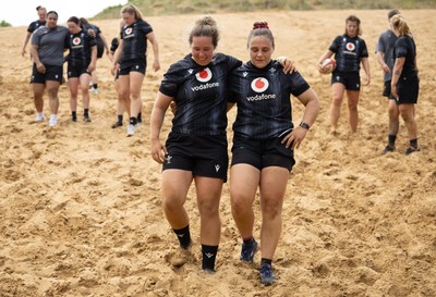 130625 Wales Women Rugby Squad Training at Merthyr Mawr dunes - Katherine Baverstock and Jenni Scoble during a training and conditioning session at Merthyr Mawr sand dunes