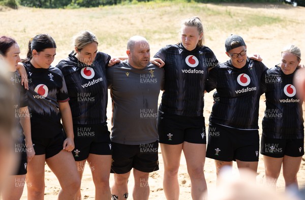 130625 Wales Women Rugby Squad Training at Merthyr Mawr dunes - Wales Women head coach Sean Lynn speaks to the Wales Women squad during a training and conditioning session at Merthyr Mawr sand dunes