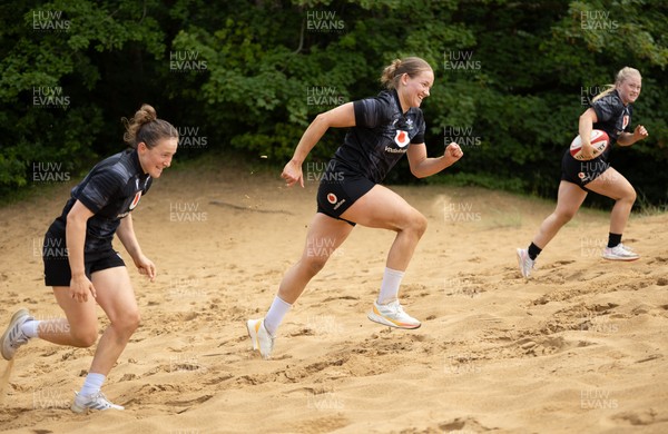 130625 Wales Women Rugby Squad Training at Merthyr Mawr dunes - Jenny Hesketh, Carys Cox and Seren Lockwood during a training and conditioning session at Merthyr Mawr sand dunes