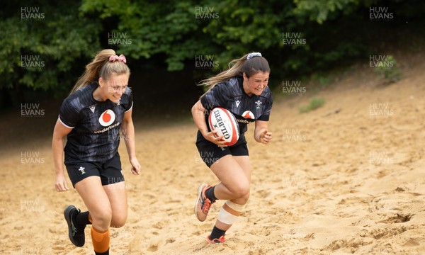 130625 Wales Women Rugby Squad Training at Merthyr Mawr dunes - Hannah Jones of Wales and Kayleigh Powell during a training and conditioning session at Merthyr Mawr sand dunes