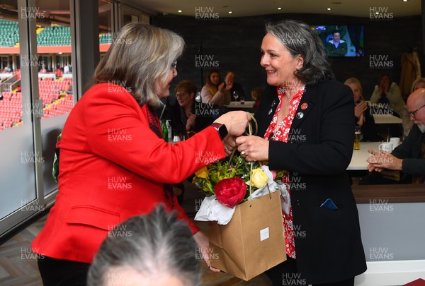 300422 - Wales Women v Italy Women - TikTok Women's Six Nations - Sue Wilson receives flowers from Cilla Davies