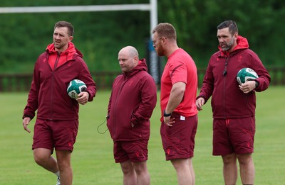 080526 - Wales Women Rugby Captains Run - Left to right, Ashley Beck, Wales Women interim attack coach, Sean Lynn, Wales Women head coach, Tyrone Holmes, Wales Women defence coach and Steve Salvin, Wales Women interim forwards coach during Captains Run at Pirrie Park ahead of the Women’s 6 Nations match against Ireland at Affidea Stadium