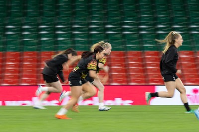 100426 - Wales Women Rugby Captain’s Run - The Wales match squad warm up during Captain’s Run at the Principality Stadium ahead of the opening Women’s 6 Nations match against Scotland