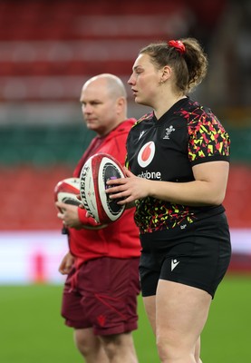 100426 - Wales Women Rugby Captain’s Run - Sean Lynn, Wales Women head coach with Gwenllian Pyrs during Captain’s Run at the Principality Stadium ahead of the opening Women’s 6 Nations match against Scotland