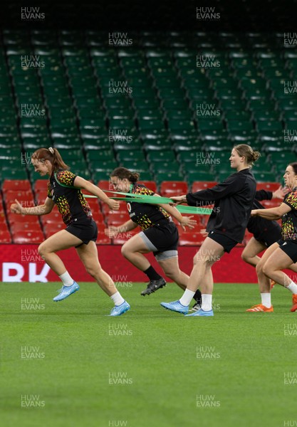 100426 - Wales Women Rugby Captain’s Run - The Wales match squad warm up during Captain’s Run at the Principality Stadium ahead of the opening Women’s 6 Nations match against Scotland