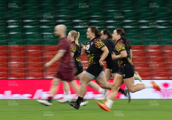 100426 - Wales Women Rugby Captain’s Run - The Wales match squad warm up during Captain’s Run at the Principality Stadium ahead of the opening Women’s 6 Nations match against Scotland