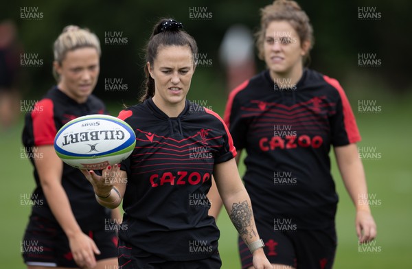 130922 - Wales Women Captains Run - Ffion Lewis of Wales with Alisha Butchers of Wales and Natalia John of Wales during the Captains Run ahead of their World Cup warm up match against England