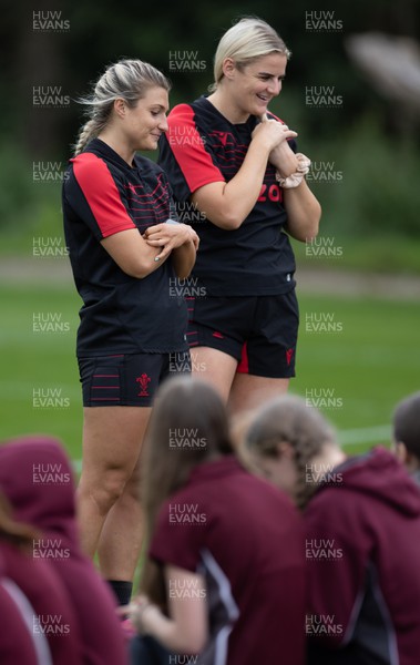 130922 - Wales Women Captains Run - Lowri Norkett of Wales and Carys Williams-Morris of Wales talk to watching schoolchildren during the Captains Run ahead of Wales Women’s World Cup warm up match against England