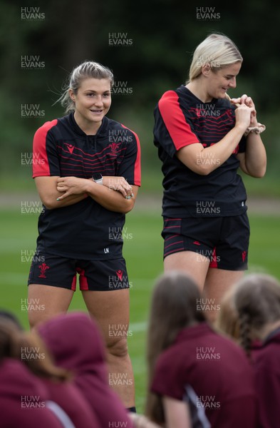 130922 - Wales Women Captains Run - Lowri Norkett of Wales and Carys Williams-Morris of Wales talk to watching schoolchildren during the Captains Run ahead of Wales Women’s World Cup warm up match against England