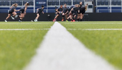 210325  Wales Women Rugby Captain’s Run - Georgia Evans breaks during Captain’s Run at The Hive Stadium Edinburgh ahead of the opening match of the Women’s 6 Nations against Scotland