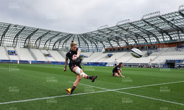 220423 - Wales Women Rugby Captains Run - Keira Bevan goes through her kicking practice at the Stade des Alpes in Grenoble ahead of the TicTok Women’s 6 Nations match against France