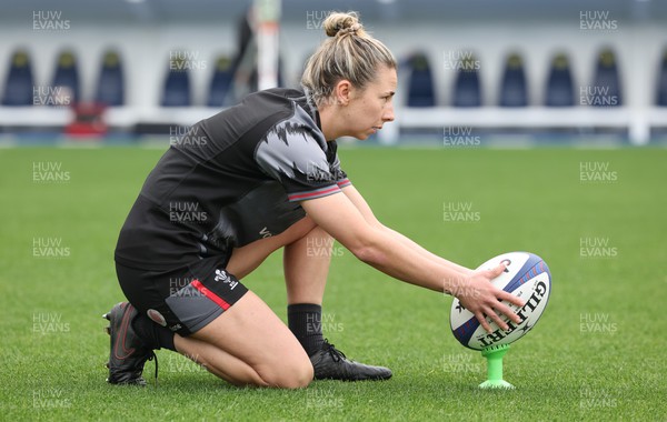 220423 - Wales Women Rugby Captains Run - Elinor Snowsill goes through her kicking practice at the Stade des Alpes in Grenoble ahead of the TicTok Women’s 6 Nations match against France