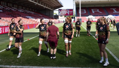 240426 - Wales Women’s Rugby Captain’s Run - Alisha Joyce shares a joke with Georgia Evans during Captain’s Run at Ashton Gate, ahead of the Women’s 6 Nations match against England