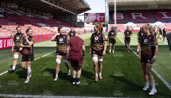 240426 - Wales Women’s Rugby Captain’s Run - Alisha Joyce shares a joke with Georgia Evans during Captain’s Run at Ashton Gate, ahead of the Women’s 6 Nations match against England