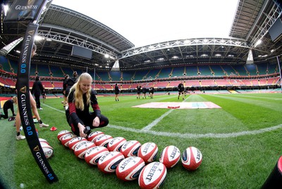 260424 - Wales Women Rugby Captain’s Run - Eve Holcombe prepares the balls during Captain’s Run at the Principality Stadium ahead of Wales’ Guinness Women’s 6 Nations match against Italy