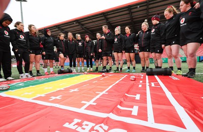 120424 - Wales Women Rugby Walkthrough - Ioan Cunningham, Wales Women head coach, speak to the players during Captain’s Walkthrough and kickers session at Virgin Media Park, Cork, ahead of Wales’ Women’s 6 Nations match against Ireland