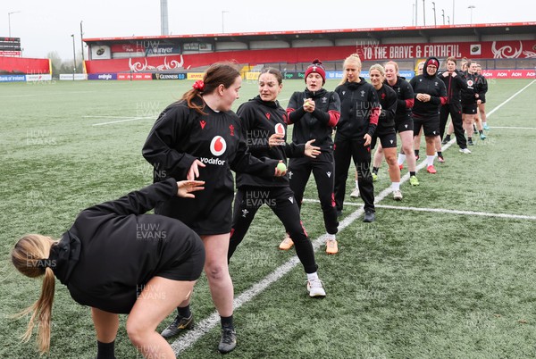 120424 - Wales Women Rugby Walkthrough - The Wales team go through some warm up games during Captain’s Walkthrough and kickers session at Virgin Media Park, Cork, ahead of Wales’ Women’s 6 Nations match against Ireland