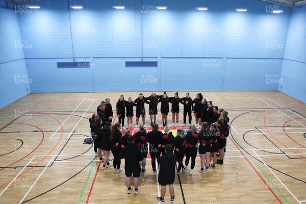 290324 - Wales Women Rugby Walkthrough  - The Wales team huddle up during Captain’s Walkthrough ahead of the Guinness Women’s 6 Nations match against England The session took place indoors due to torrential rain
