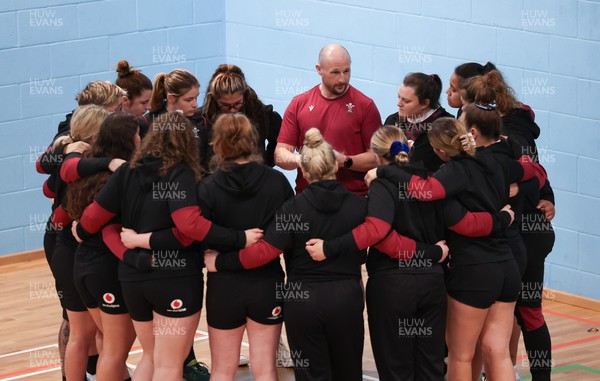 290324 - Wales Women Rugby Walkthrough  - Mike Hill, Wales Women forwards coach, speaks to the forwards during Captain’s Walkthrough ahead of the Guinness Women’s 6 Nations match against England The session took place indoors due to torrential rain