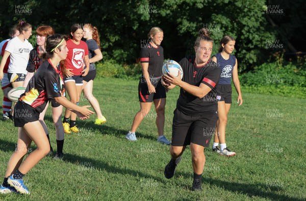 250822 - Wales Women Rugby Community Engagement in Canada - Wales’ Carys Phillips working with Halifax RFC Junior Girls during a training session in Halifax, Canada
