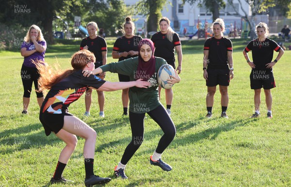 250822 - Wales Women Rugby Community Engagement in Canada - Wales’ Alisha Butchers, Carys Phillips, Gwen Crabb, Kerin Lake and Keira Bevan watch Halifax RFC Junior Girls during a training session in Halifax, Canada