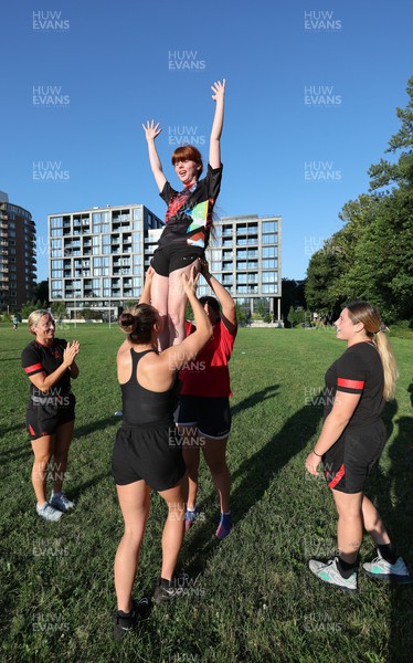 250822 - Wales Women Rugby Community Engagement in Canada - Wales’ Alisha Butchers and Gwen Crabb, coach a line out lift session while working with Halifax RFC Junior Girls during a training session in Halifax, Canada