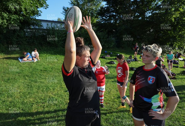 250822 - Wales Women Rugby Community Engagement in Canada - Wales’ Carys Phillips working with Halifax RFC Junior Girls during a training session in Halifax, Canada