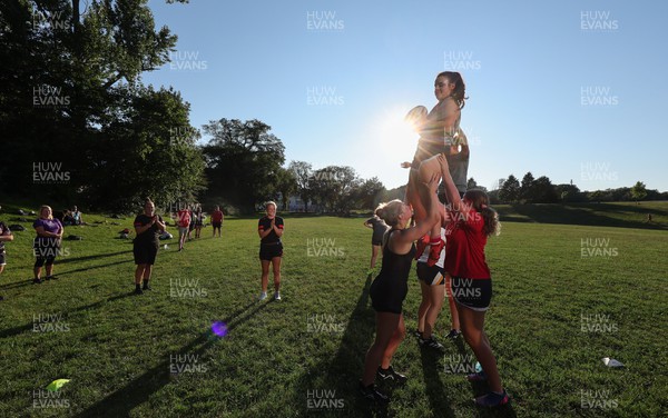250822 - Wales Women Rugby Community Engagement in Canada - Wales’ Carys Phillips and Alisha Butchers working with Halifax RFC Junior Girls on their line out during a training session in Halifax, Canada